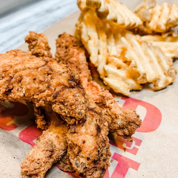 Crispy fried chicken tenders and golden waffle fries from Bird On The Run.